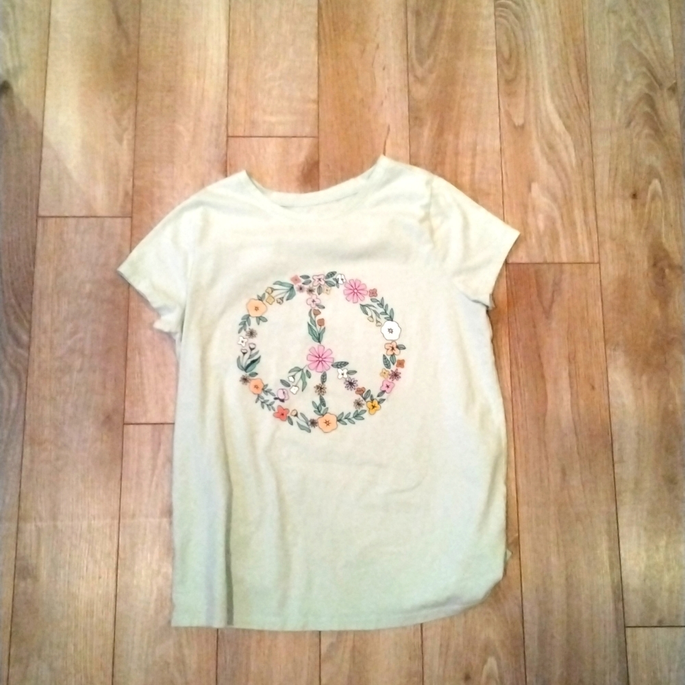 Feel comfortable shirt with a peace sign on it